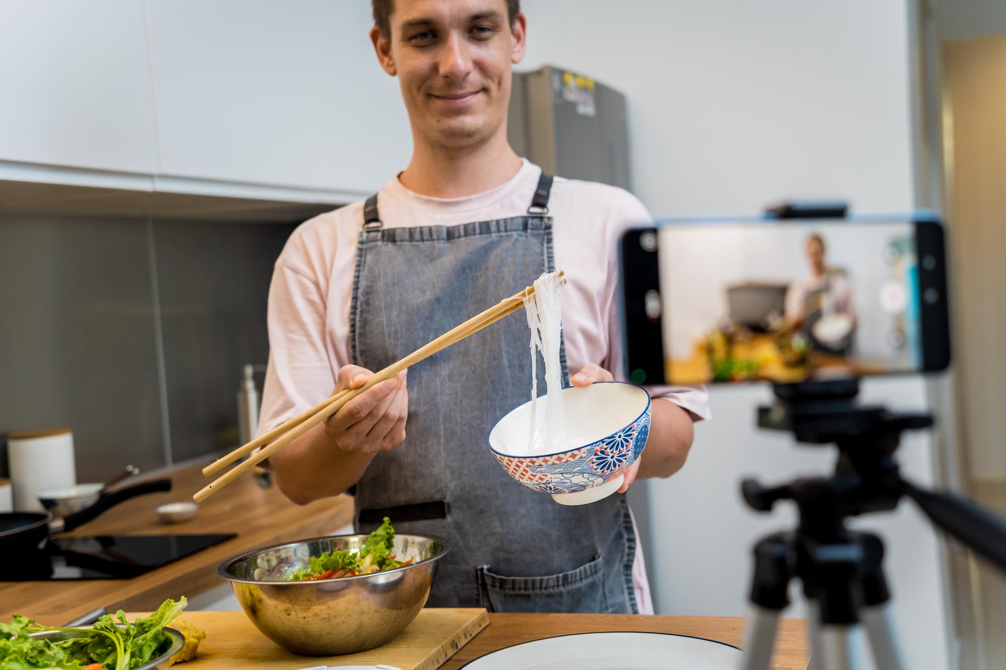 Instructor demonstrating sauce technique on camera
